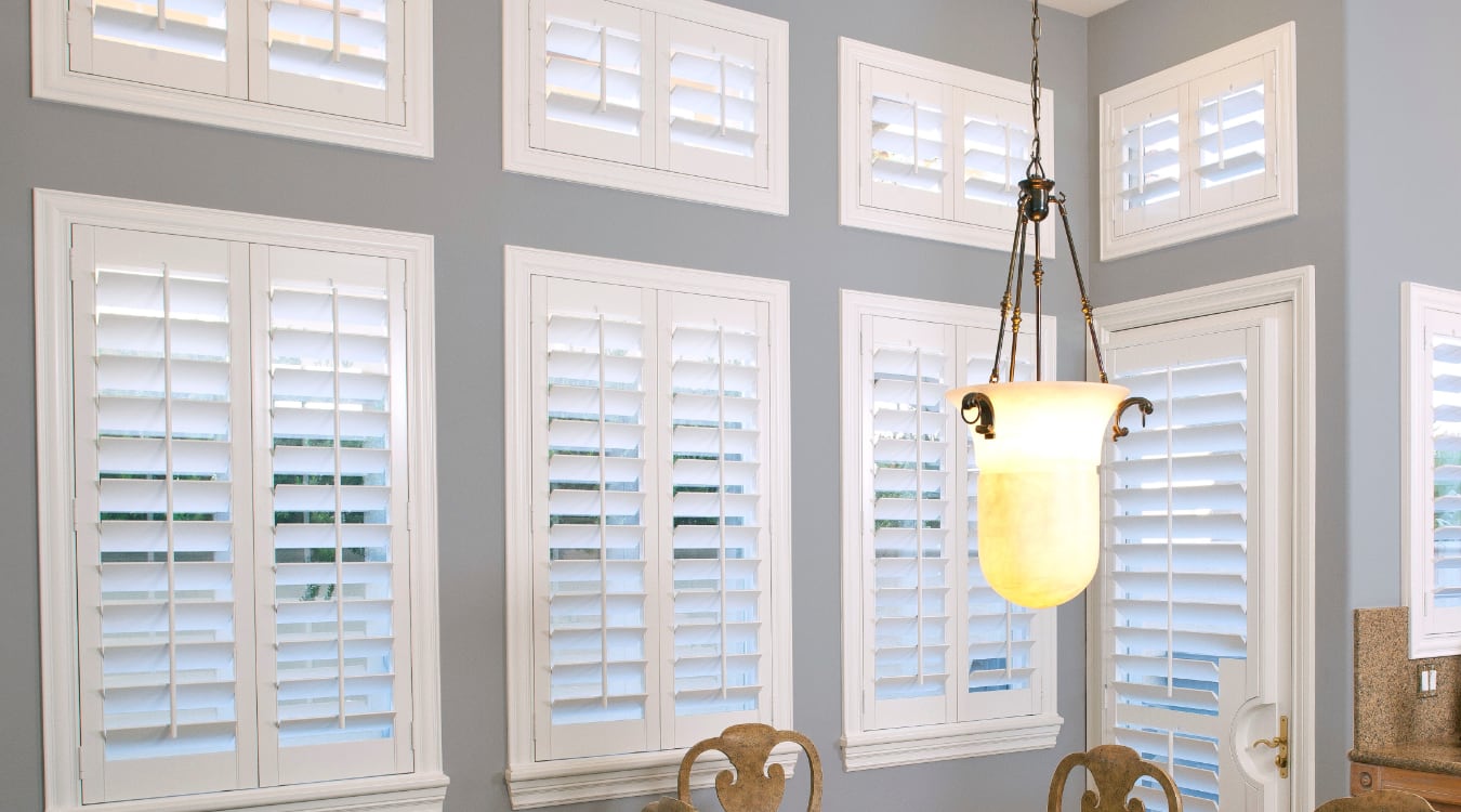 Casement windows with planation shutters